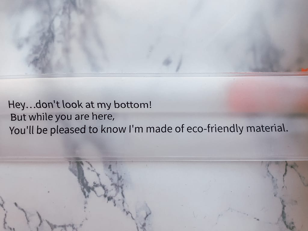 message on bottom of grin naturals plastic toiletry pouch