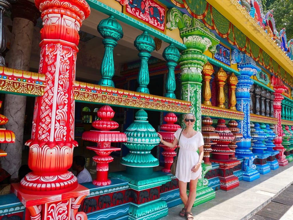 colourful pillars batu caves temple kl yellow feather blog