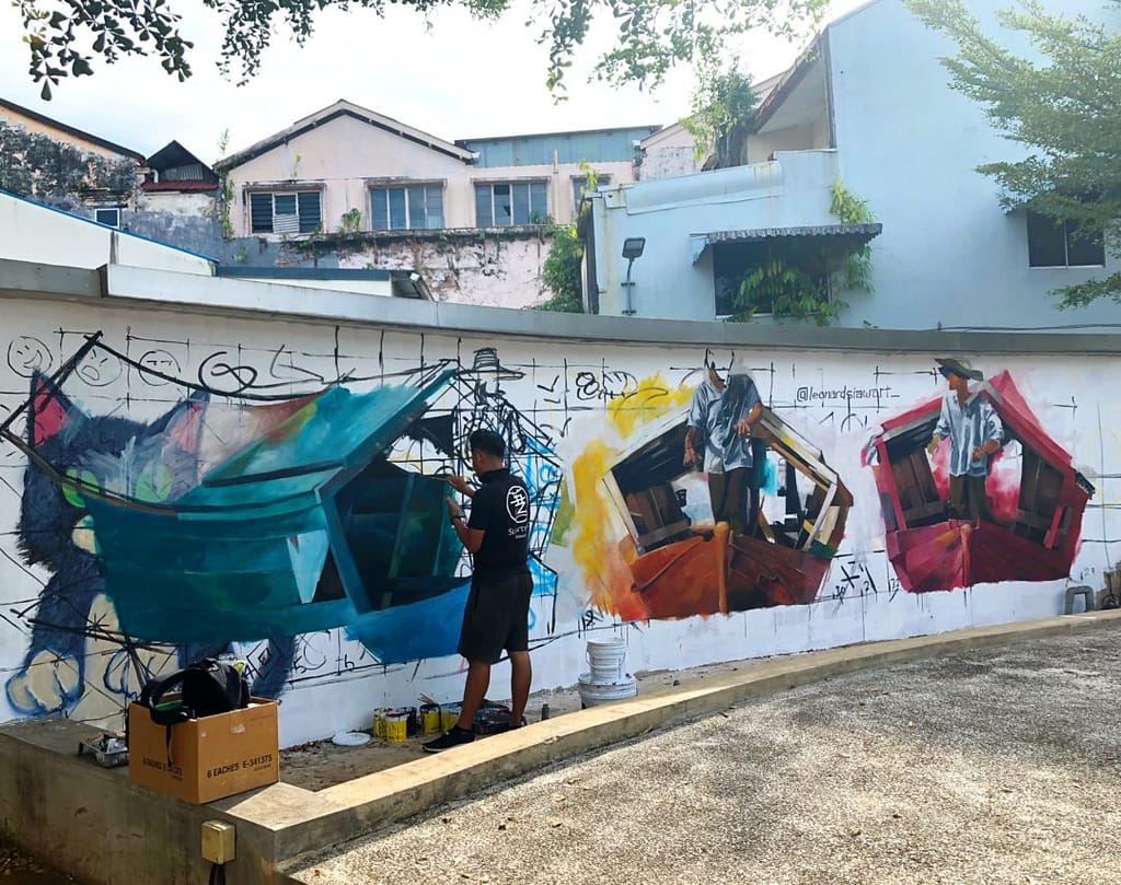 street art in progress colourful kuching malaysia yellow feather blog
