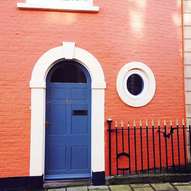 blue-door-on-orange-wall-bristol-doors-brunswick-square-st-pauls