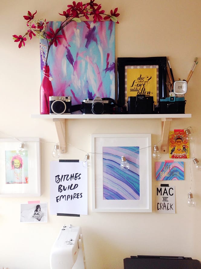 Gallery wall complete with local art, marble print and inspirational phrase