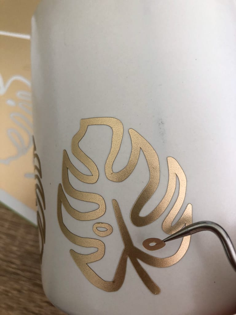 placing gold vinyl monstera leaf decorative jar yellow feather blog