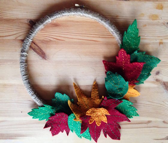 The finished autumn wreath will felt leaves and yarn wrapped hoop - yellow feather blog