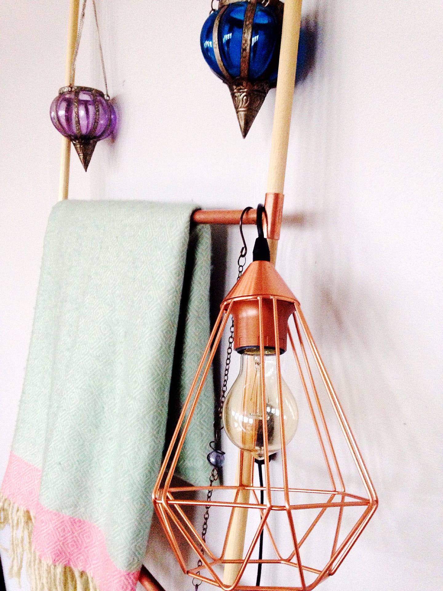 Decorative copper and wood ladder with copper wire hanging lamp