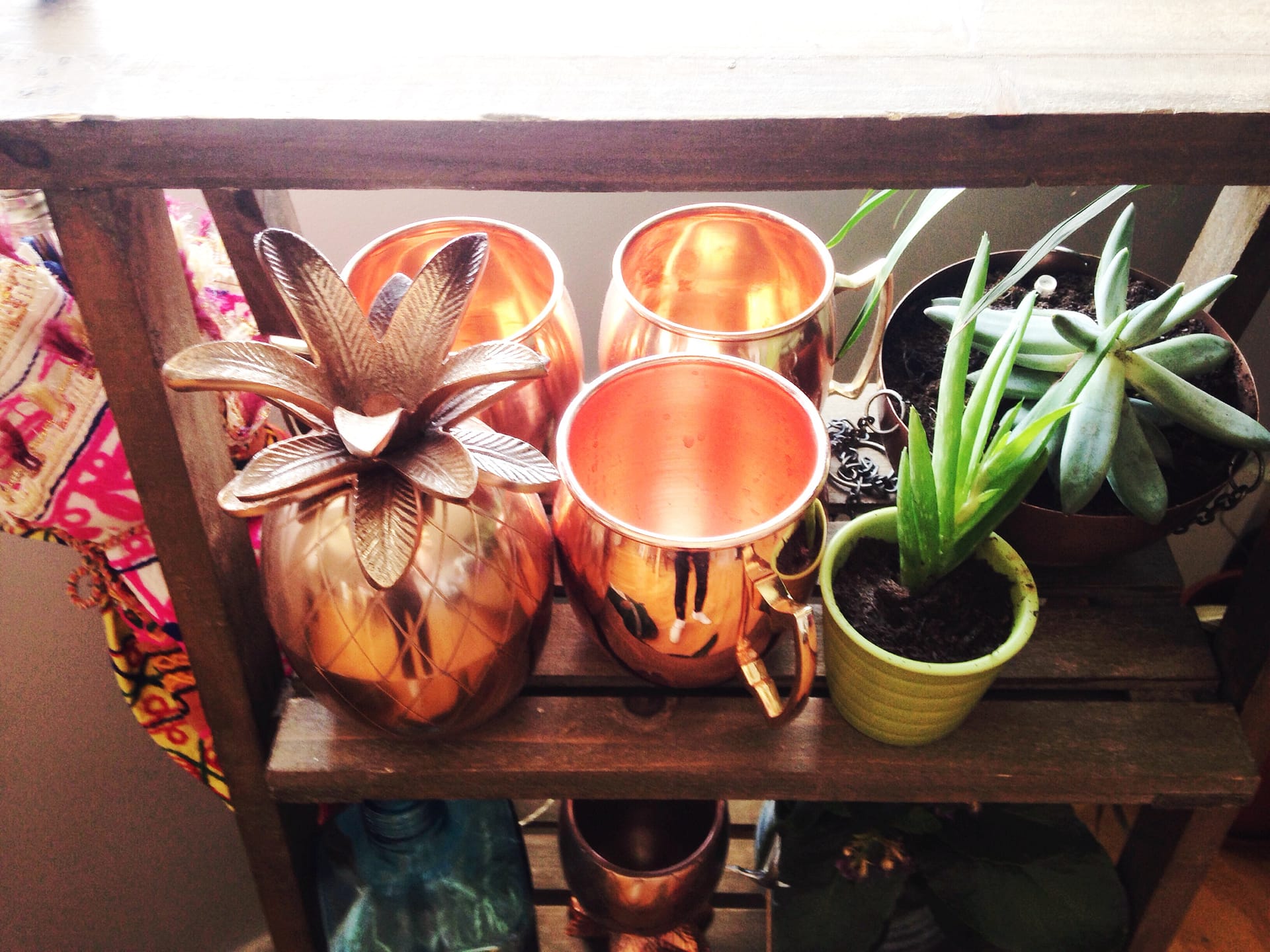 Use a plant stand to hold barware as well
